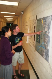Cavers admiring the handiwork of the Cartography Salon entries.