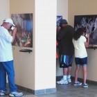 Visitors at Carlsbad Caverns National Park examine 3D photographs of Lechuguilla Cave