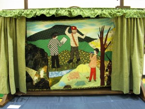 Janet and Roland Vinyard's "Cranky," a 26 foot-long quilt featuring a graphic story which is accompanied with a live music ballad. Photo by Carolina Shrewsbury