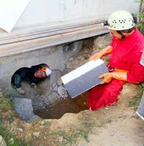 Members of the Speleological Society of Geneva Installing Insulation