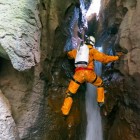 Caver Andy McKenzie climbing in Peru's Cueva Jadibamba