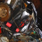 The mangled vehicle in the cave after the fall.