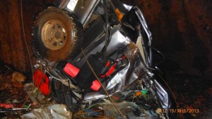 The mangled vehicle in the cave after the fall.