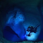 Cave Diver Brett Hemphill descending toward the deepest section of the cave.