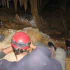 Caver surveying in Arizona's KyPet Caverns.