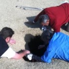 Lowering a ladder to a golfer trapped in sinkhole.