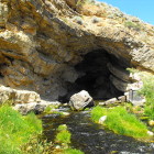 The cave and outflow of Ricks Spring in mid-summer.