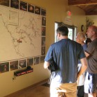 Visitors admiring a map of Indiana's Binkley Cave System.