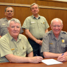 Wind Cave Superintendent Vidal Davila, Hell Canyon District Ranger Lynn Kolund, Fall River District Ranger Mike McNeill and Jewel Cave Superintendent Larry Johnson signing the Agreement.