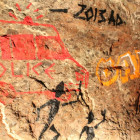 Chalk paintings showing police chasing graffiti artists.