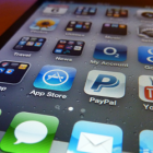 Apps fill the iPhone home screen.