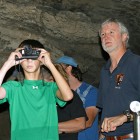A visitor watching bats through night-vision goggles during a previous bat night at Mammoth Cave.