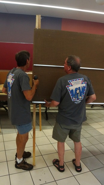 Volunteers assemble the NSS Fine Arts Salon displays.