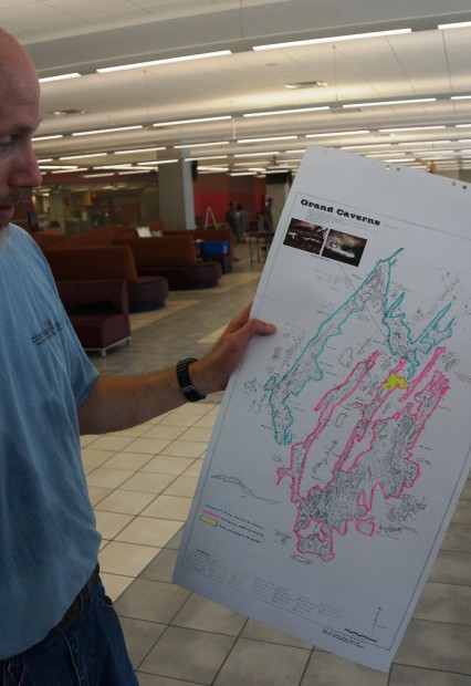 Cave 3-D photographer Charles Kahn shows the Grand Caverns map, and the newly discovered section (highlighted in pink) which is featured in is 3-dimensional cave photograph.