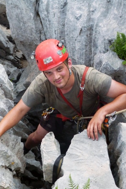 York student Jonathan Booth exploring a cave entrance.