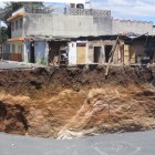 Close to the edge of the 100 meter (330 foot) deep sinkhole which formed in Guatemala City in 2007. Photo by Eric Heather Haddox/flickr