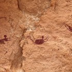 Painting of swimmers in Egypt's Cave of the Swimmers.