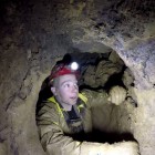 Muddy cave digging in Grebe Swallet.