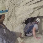 Student's enter California's Arroyo Tapiado mud caves.