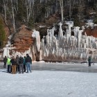 Visitors view the ice caves at Apostle Islands National Lakeshore in Wisconsin.