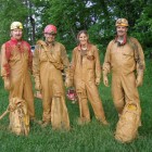 Happy mud-covered cavers.