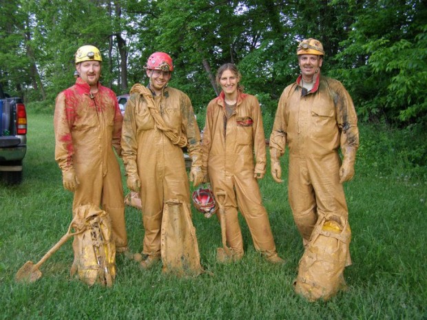 Happy mud-covered cavers.