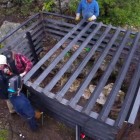 Cavers assemble Ezells Cave gate.