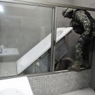 A removable bathtub provides hidden access to an underground tunnel.