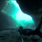 Freediver Youbuur exploring the Comino Island caves of Malta.