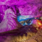 The colorful lighting inside Wookey Hole Caves.
