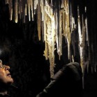 Paul Kemp cleans lint off stalactites inside Lehman Cave at Great Basin National Park.