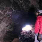 A caver exploring a lava tube in El Malpais National Monument.