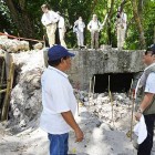 Palau President Tommy Remengesau observes the work of a Japanese team searching for the remains of soldiers who died in battle on Peleliu Island, Palau.