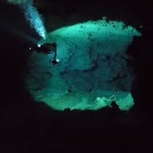 Cave divers ride exploring somewhere under the jungle in Mexico's Riviera Maya.