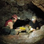 Cavers Chris Pelczarski and Dan Austin (left to right) updating their cave journals during the recent trip exploring in the western branch of Jewel Cave.