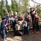 Children with their bows and arrows constructed at Kents Cavern Stone Age School.