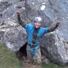 An Aberystwyth Caving Club member exiting Ogof y Daren Cilau.