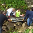 Cavers installing at door at Spring Cave.