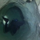 Diving inside Sardinia's Grotta dei Fantasmi.