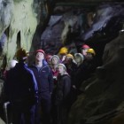 Visitors inside Ingleborough Cave.